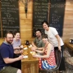 a group of people sitting at a table