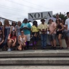 a group of people standing in front of a crowd