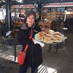 a person sitting at a table in a restaurant