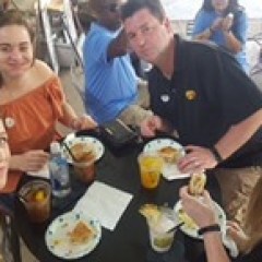 a group of people sitting at a table
