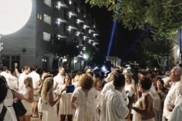 a group of people standing in front of a crowd