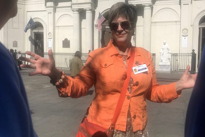 a man standing in front of a building