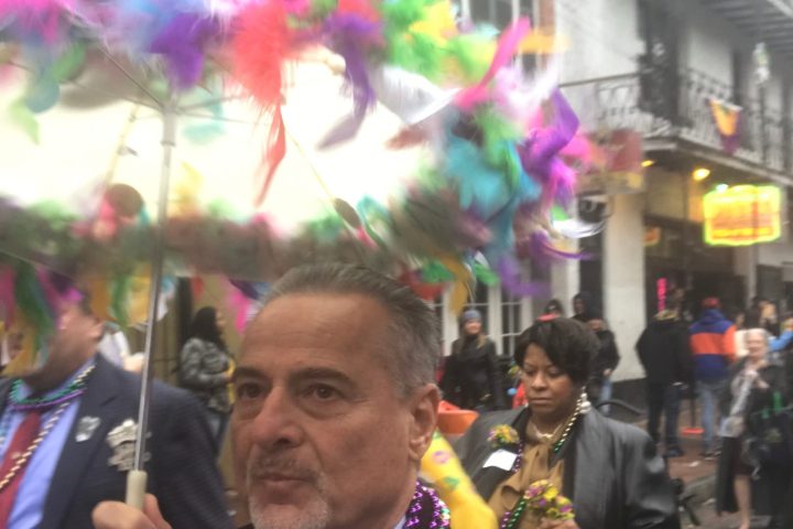 a man and a woman standing in front of a crowd