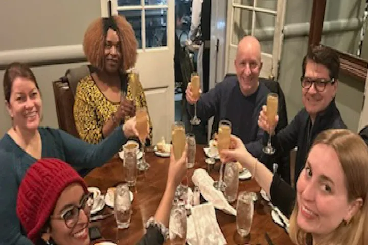 a group of people around each other