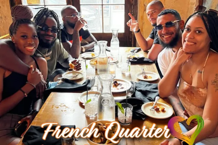 a group of people sitting at a table eating food