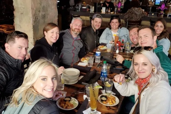 a group of people sitting at a table in a restaurant