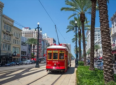 a double decker bus driving down a city street